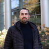 Jovan Andjelkovic stands on campus