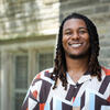 Trae Manzili smiling on campus
