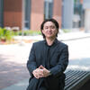 Simon Cho sitting on campus