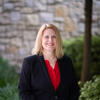 Renée M. Tobin smiling on campus
